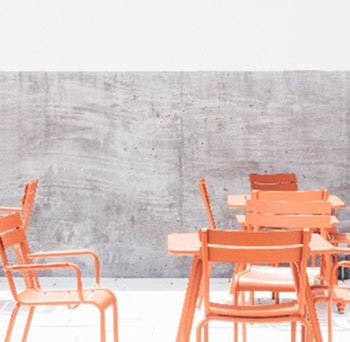 orange wooden chairs on a white background. - stock photo