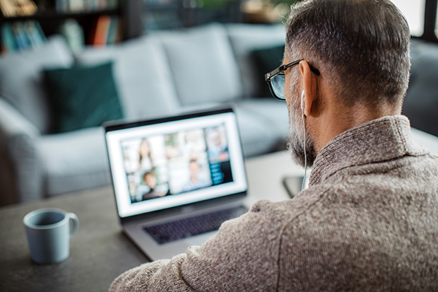 Mature man working from home - stock photo