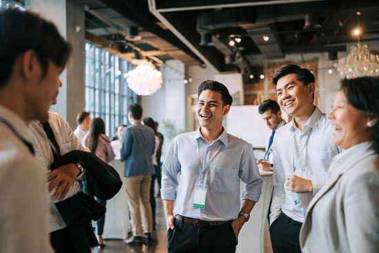 Diversify seminar participants casual chat after successful conference event at lounge - stock photo