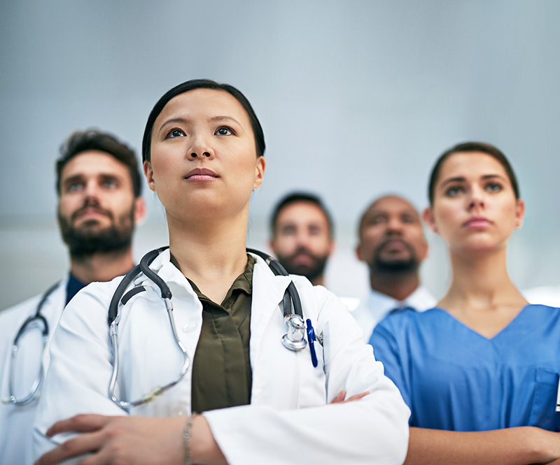 Shot of a diverse team of doctors working together in a medical institution