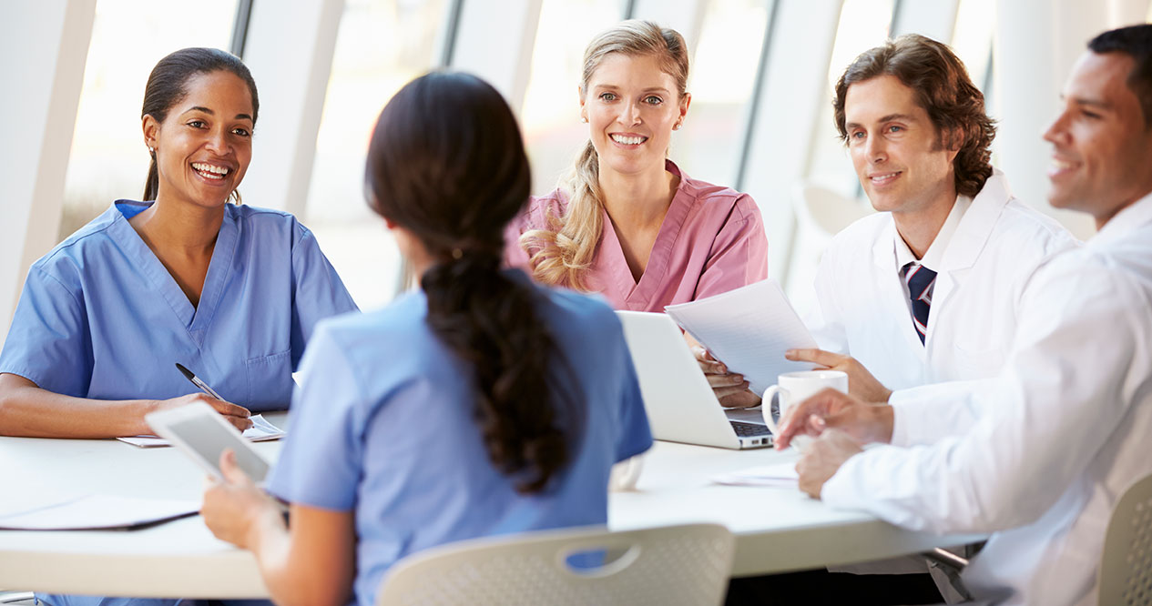 Doctors gathered around a table