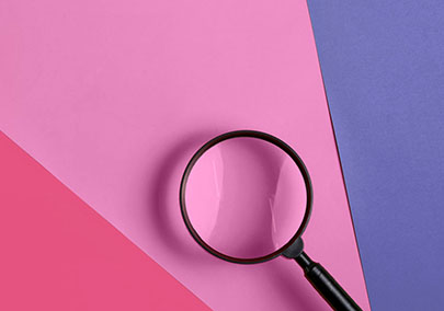 magnify glass on coloured background