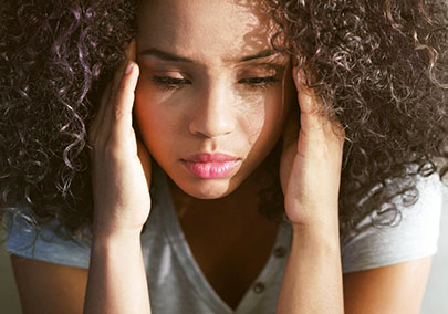 Portrait of a stressed woman on color background, sad depressed young girl isolated - stock photo