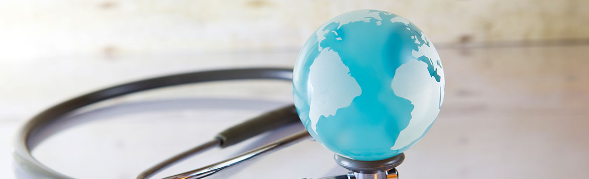 A globe on a stethoscope representing global healthcare - stock photo