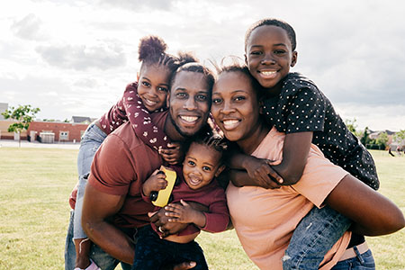 Happy family with three kids on summertime