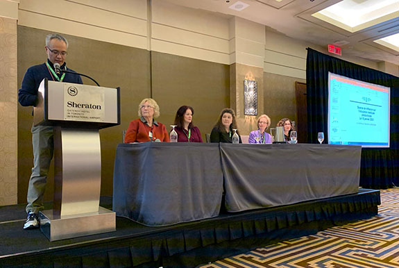 Panel of physicians speaking at an event