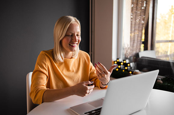 Young woman working from home - stock photo